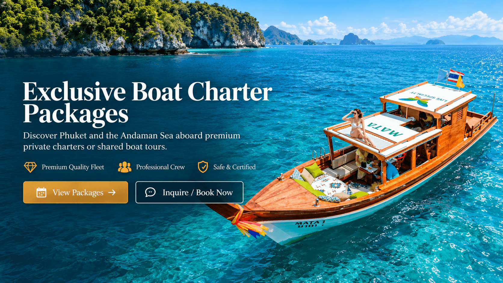 Wooden longtail boat on turquoise Andaman water beside limestone cliffs, with a guest on the sun deck.